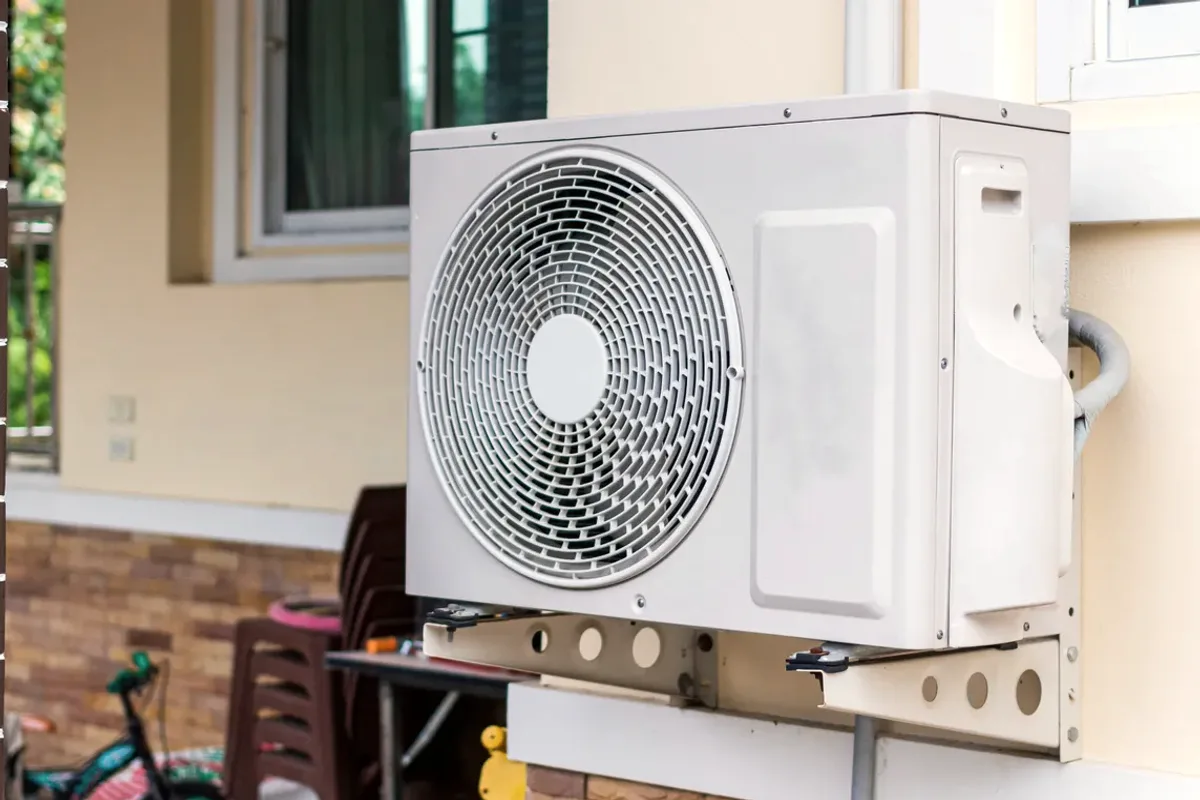 Outdoor heat pump unit on a wall bracket